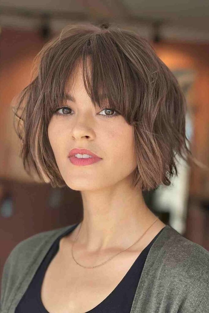 5. French Girl Wavy Bob with Wispy Bangs
