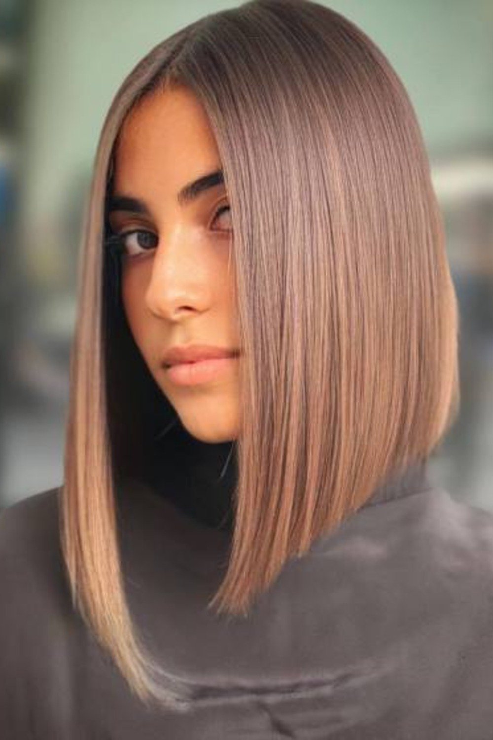 7. Choppy Platinum Angled Bob with Side Bangs