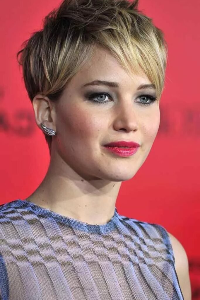 7. Spiky Textured Pixie with Blonde Highlights