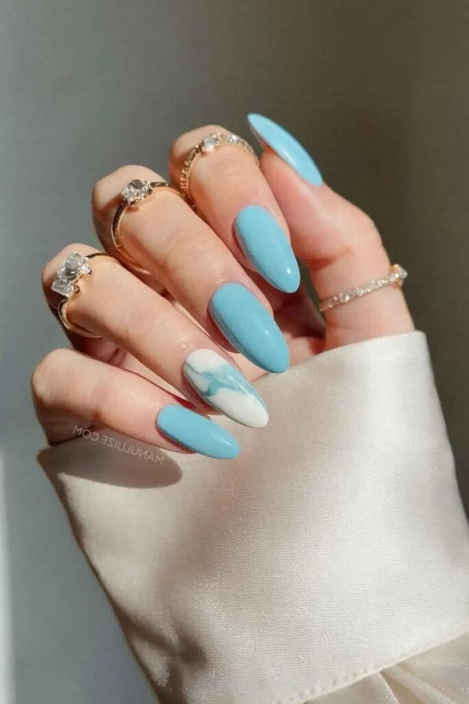8. Blue Tips with Tiny Daisies on Nude Nails
