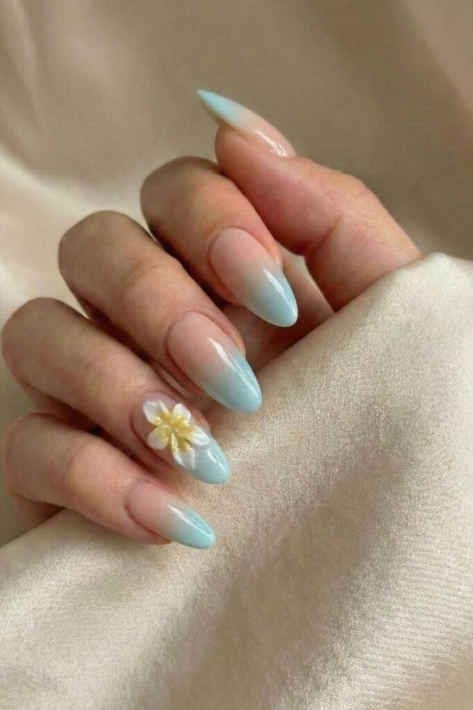 9. Powder Blue Nails with Black Outline Flowers