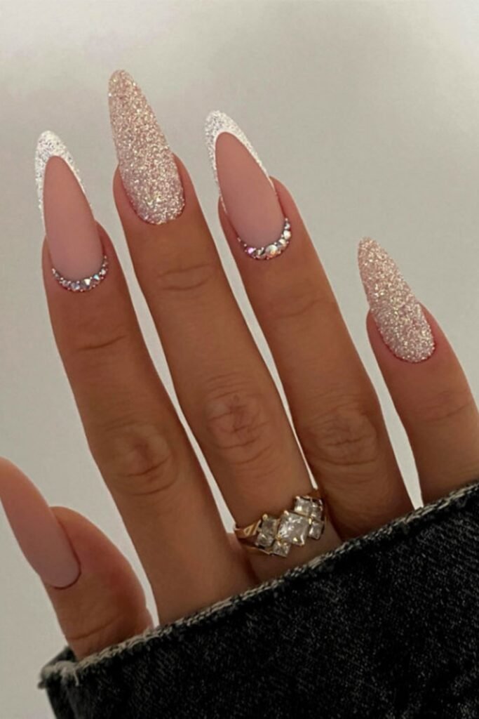 6. Matte Nude Nails with Glitter Tips and Crystals
