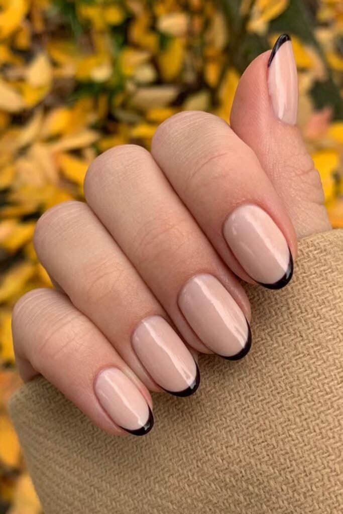 7. Nude Nails with Thin Black French Tips