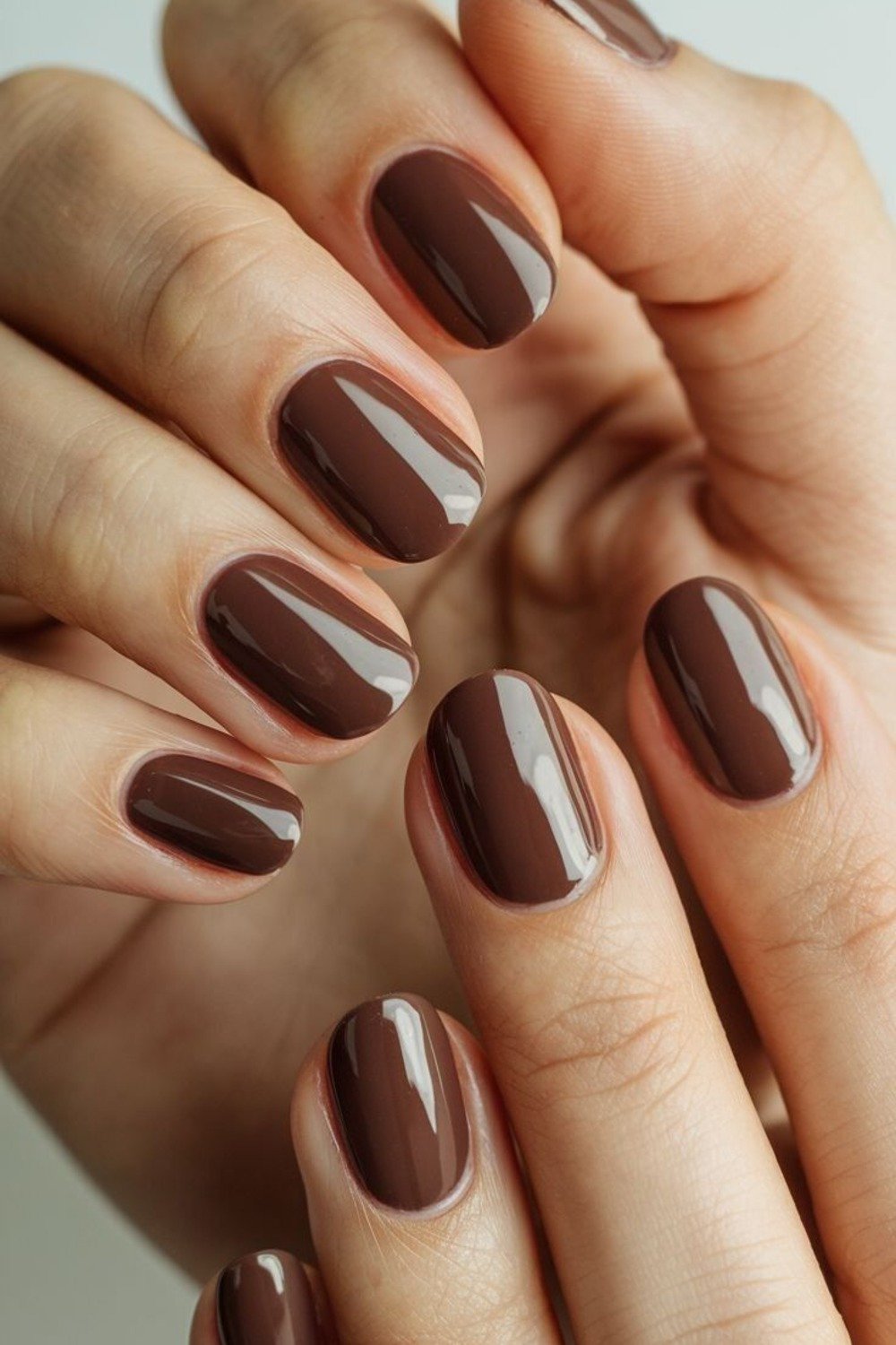 12. Glossy Cocoa Short Oval Nails