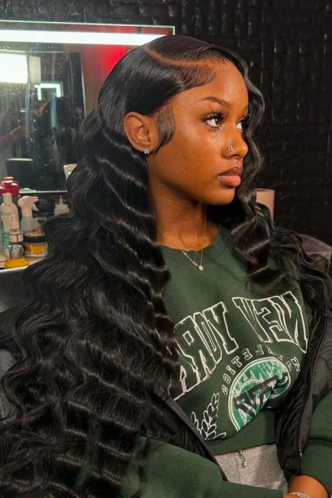 8. Sleek Side Part with Black Deep Waves