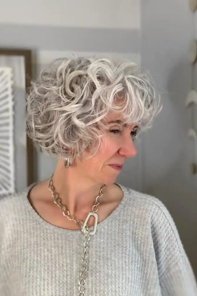 16. (Short Layered Silver Curly Bob with Bangs)