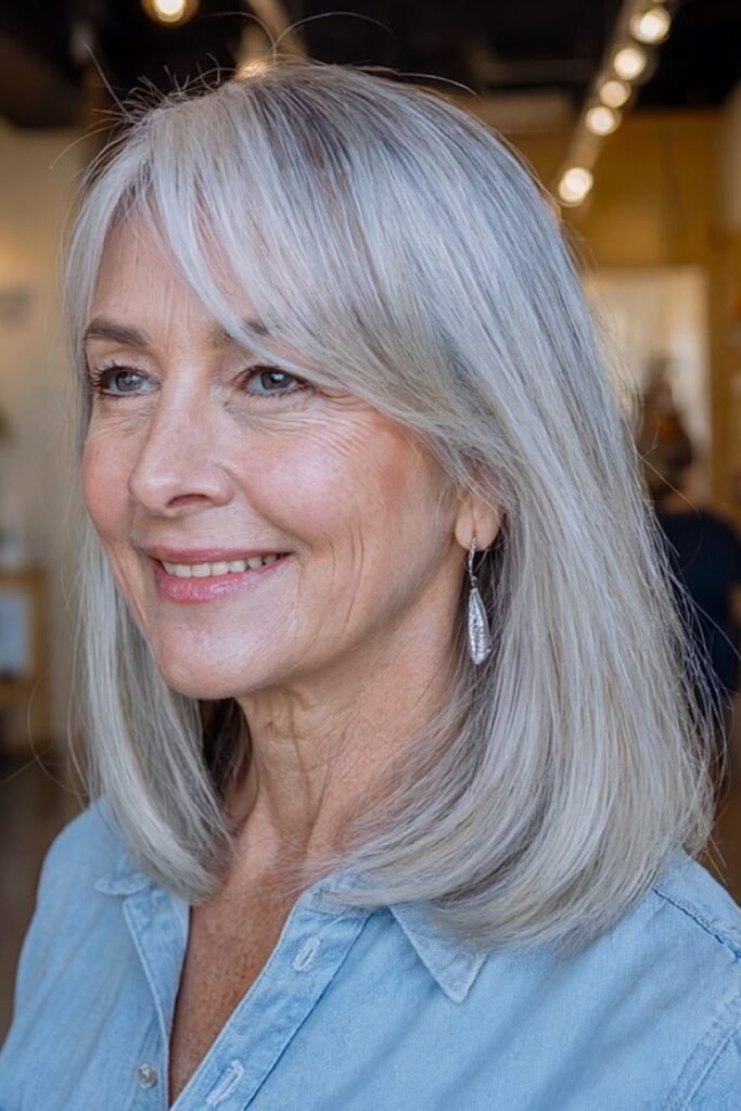 17. Smooth Silver Blonde Long Bob with Side Bangs