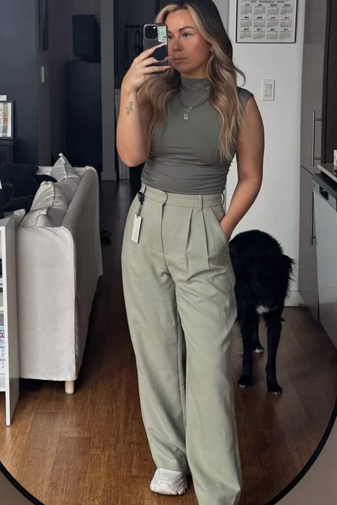 11. Sage Ruched Top with Pleated Trousers and White Sneakers
