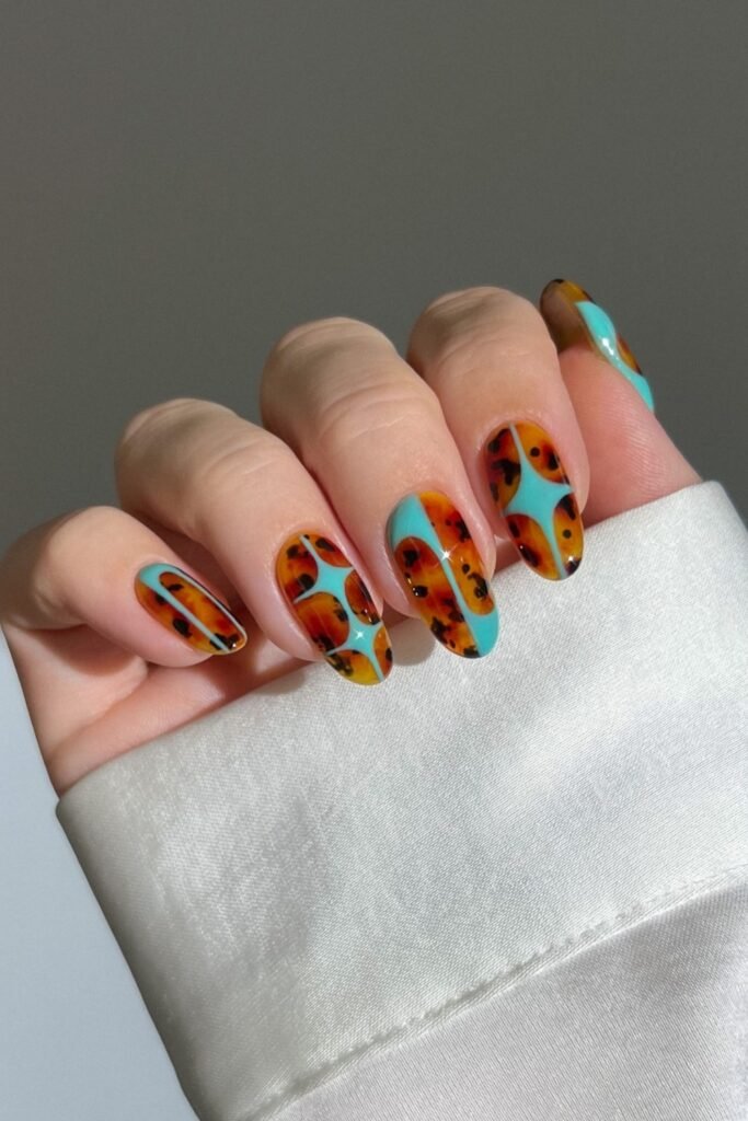 6. Tortoiseshell and Turquoise Star Nails