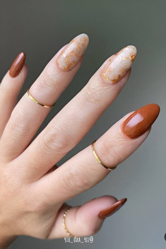 13. Rust and Gold Foil Marble Nails