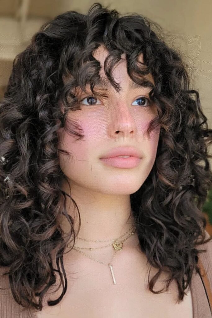 11. (Dark Curly Shag with Wispy Bangs)