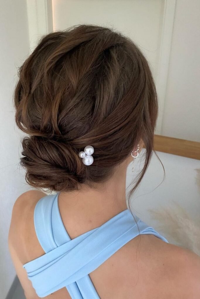 17. (Twisted Low Bun with a Pearl Pin)