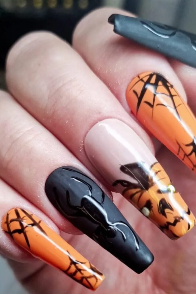8. Orange and Black Spiderweb Coffin Nails