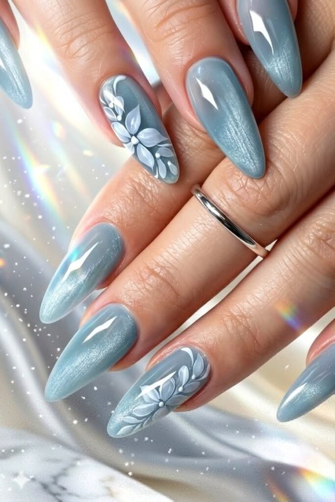 9. Icy Blue Cat-Eye Nails with White Florals