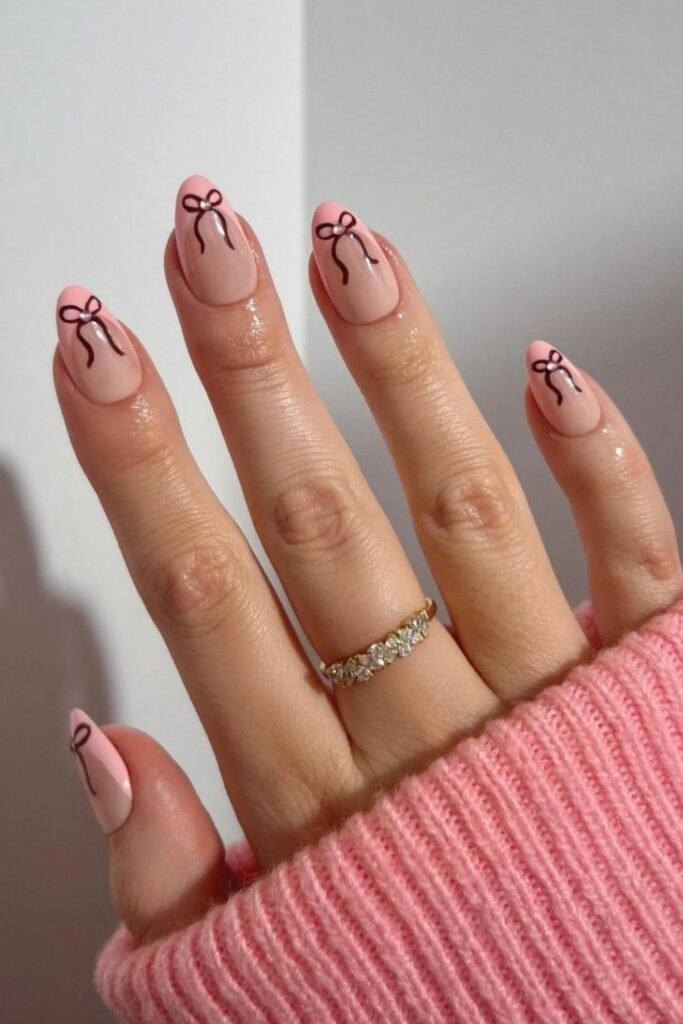 10. Brown Bow Nails on Pink French Tips