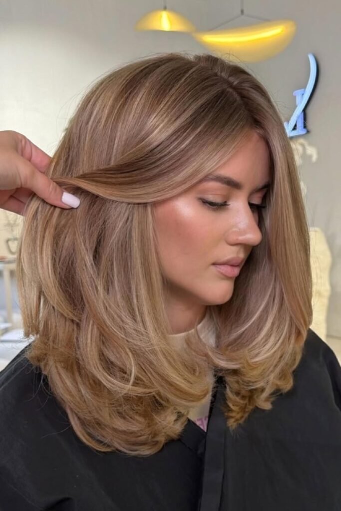 2. (Bouncy Medium Layers with Honey Blonde Tones)