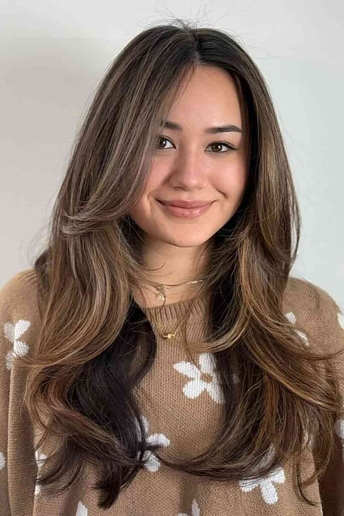 5. (Long Layers with Middle Part Curtain Bangs and Balayage)