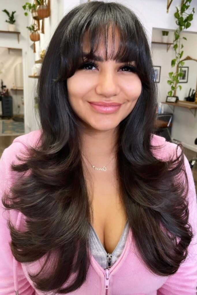 16. (Long Layers with Wispy Bangs)