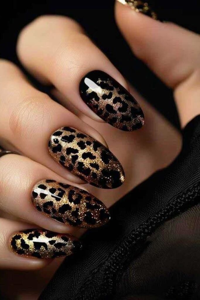 6. Black and Gold Glitter Leopard Oval Nails