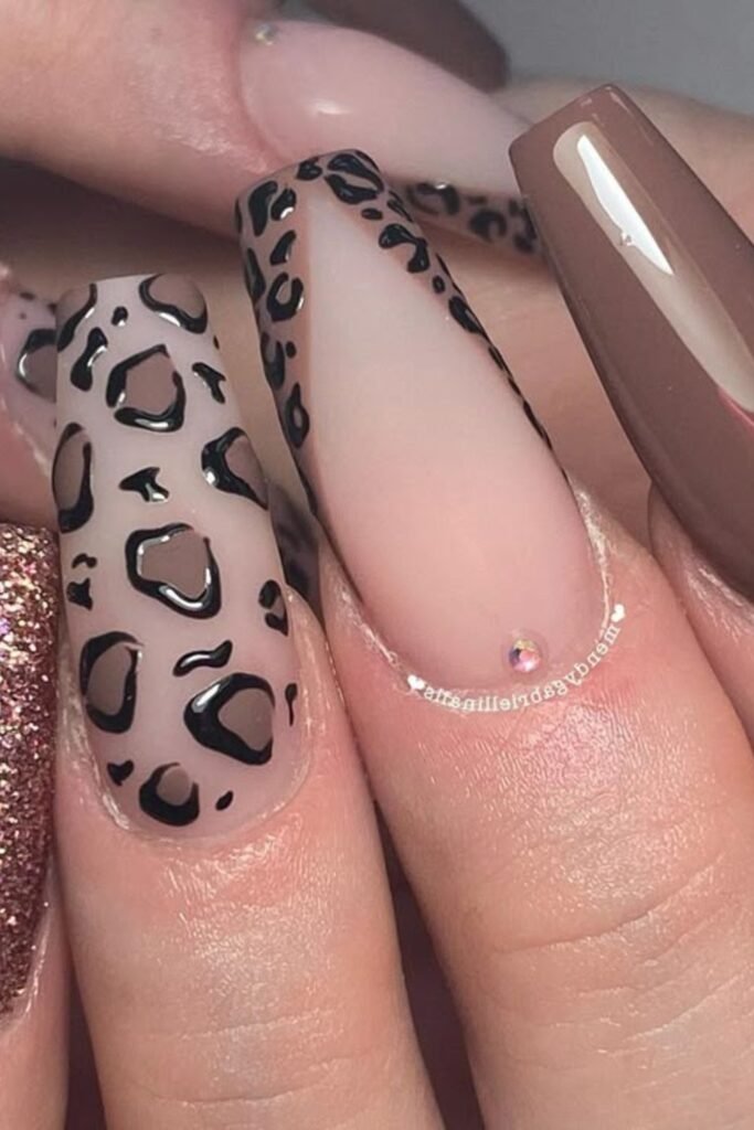 15. Negative Space Leopard Coffin Nails