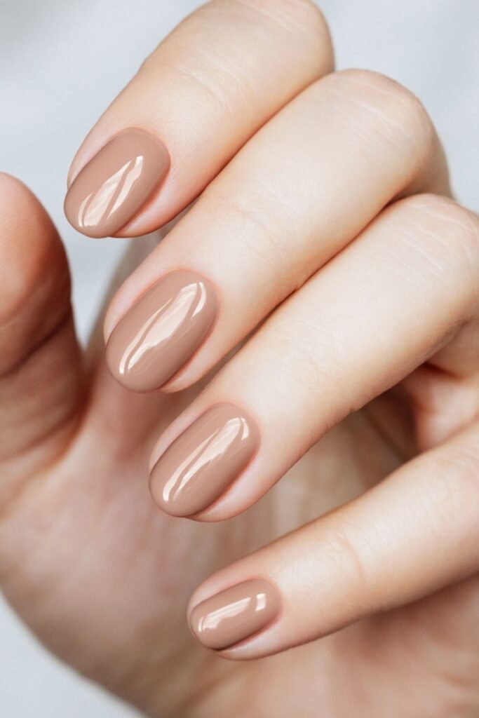 6. Glossy Latte Nude Short Nails