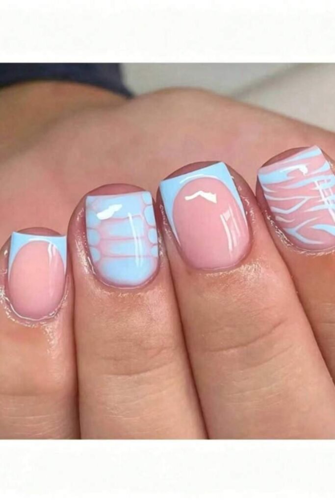 10. Baby Blue French Tips with Playful Patterns
