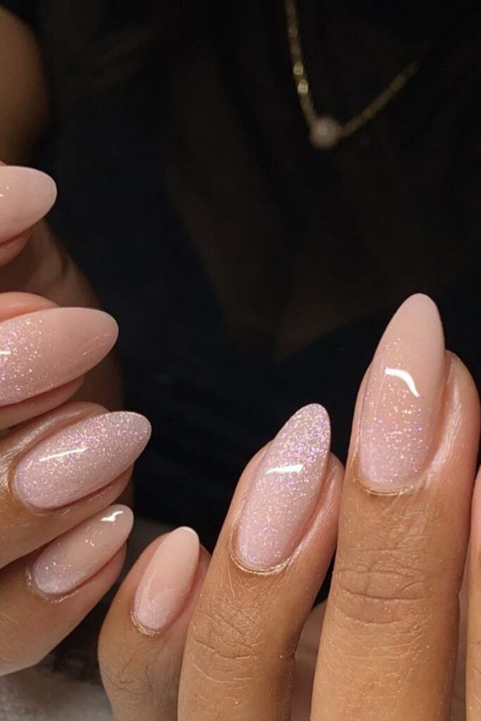 12. Shimmery Nude Glitter Nails