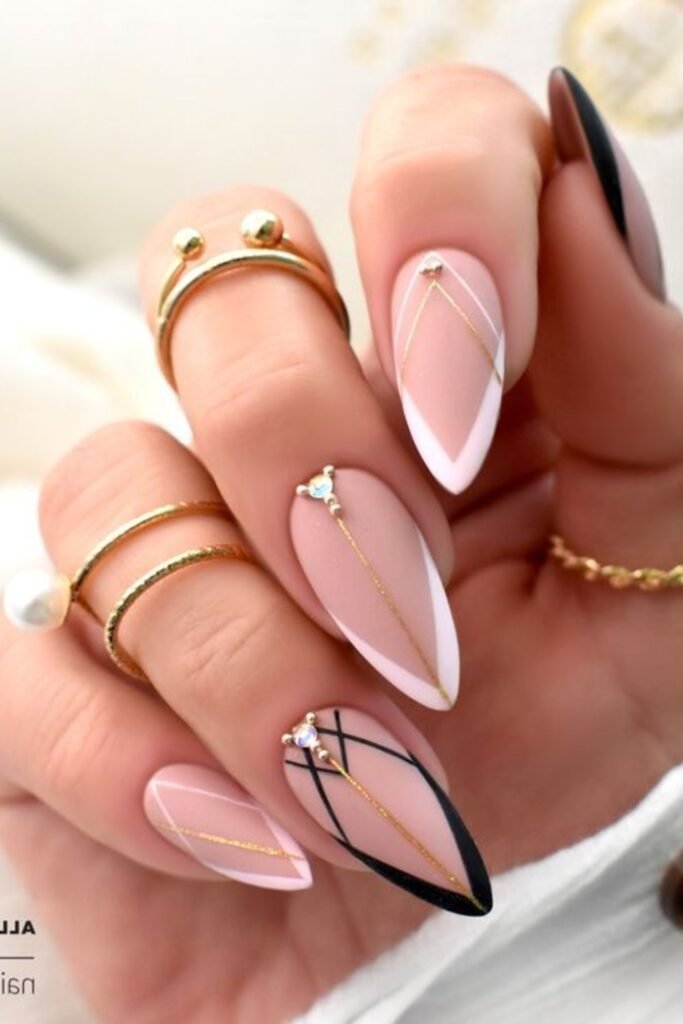 13. Geometric Gold and Black Line Nails