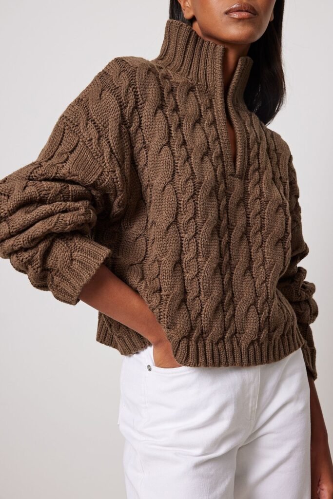15. Brown Zip-Neck Cable Sweater with White Jeans