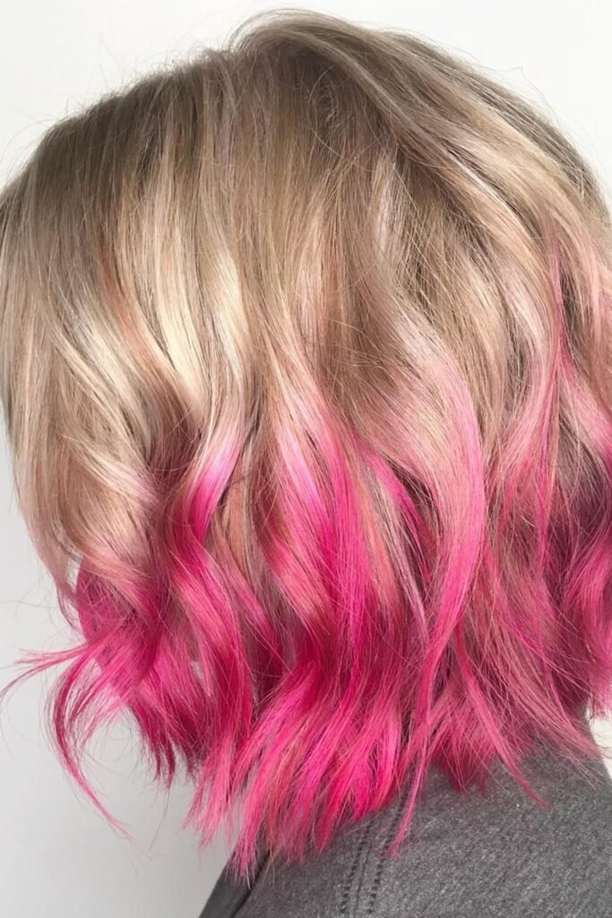 4. Dip-Dyed Hot Pink Tips on a Blonde Wavy Bob