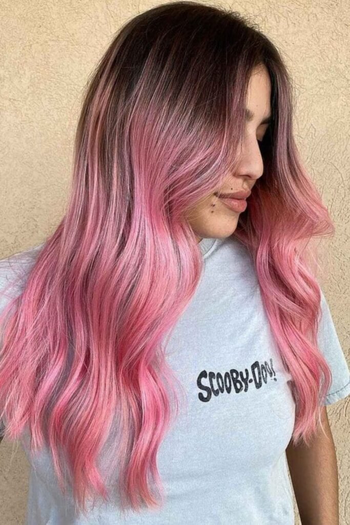 17. Cotton Candy Pink Waves with Brown Roots