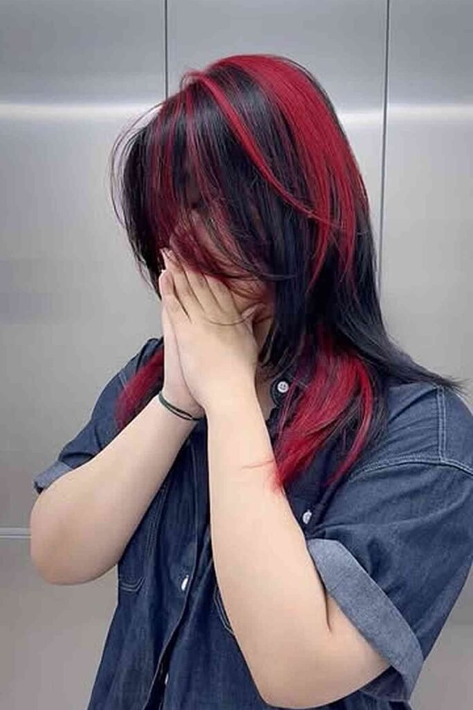 8. Black-Brown Hair With a Bold Red Face Frame