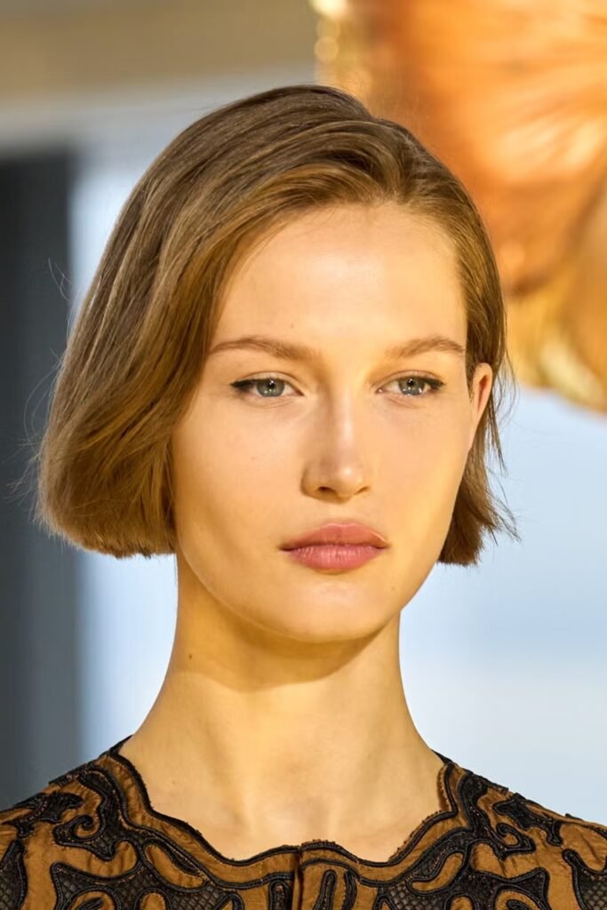 12. (Chic Chin Length Bob Tucked Behind the Ear)
