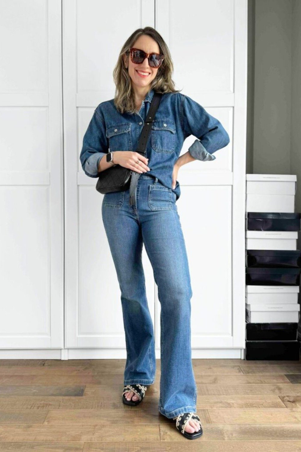 4. Dark Denim Shirt with Flare Jeans and a Quilted Bag