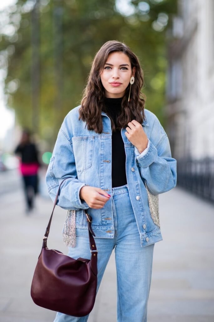 7. Fringe Denim Jacket with a Black Top and Light Jeans