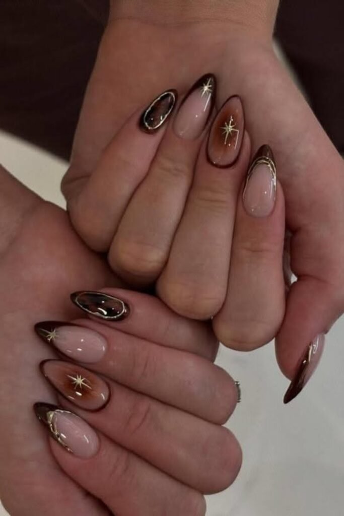2. Brown Aura French Tips with Gold Stars