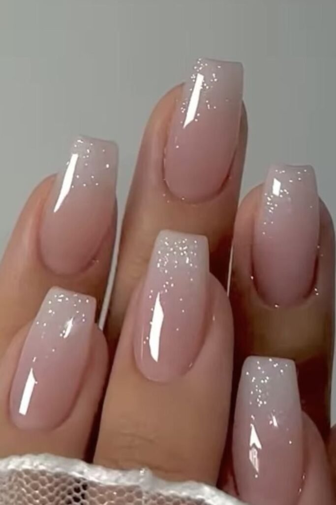 8. Sparkly Ombre Nude Coffin Nails