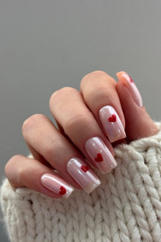 18. Red Heart Accents on Pearl Nails