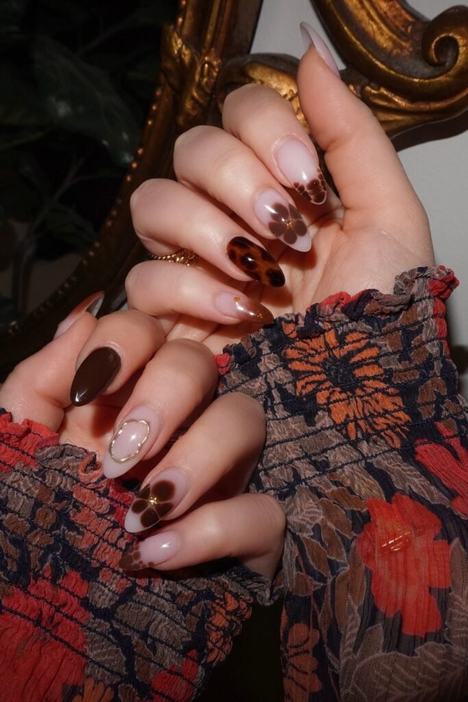 3. Brown Flower and Tortoiseshell Almond Nails