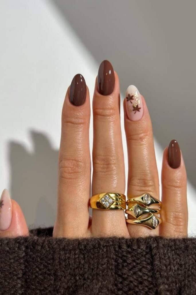 5. Chocolate Brown Nails with Maple Leaf Accents