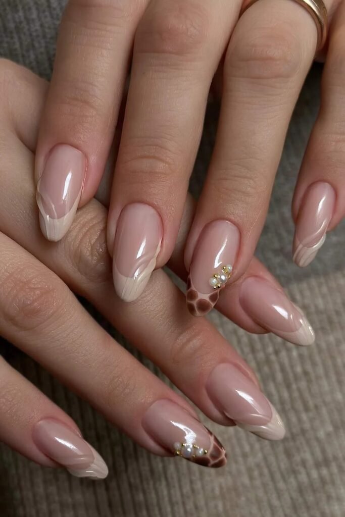 9. Giraffe Print and Cream French Almond Nails