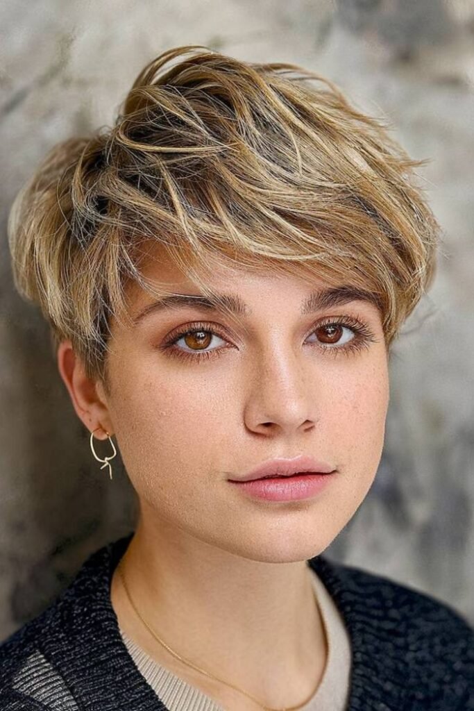 7. Honey Blonde Tousled Pixie with Long Fringe